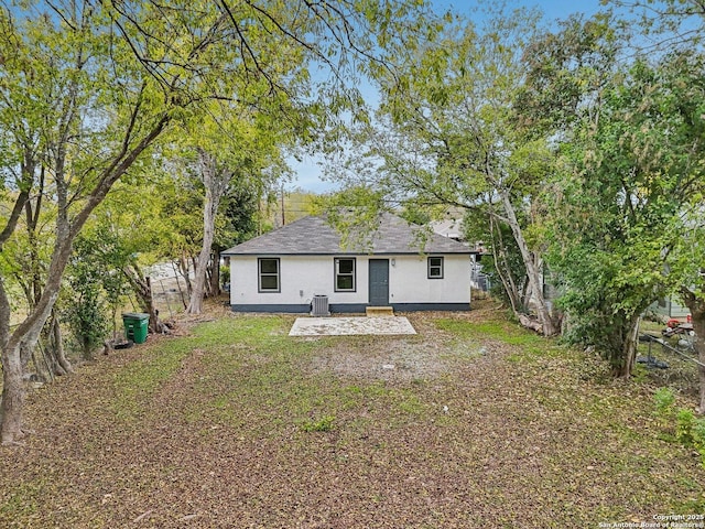 back of house featuring a patio, central air condition unit, and stucco siding