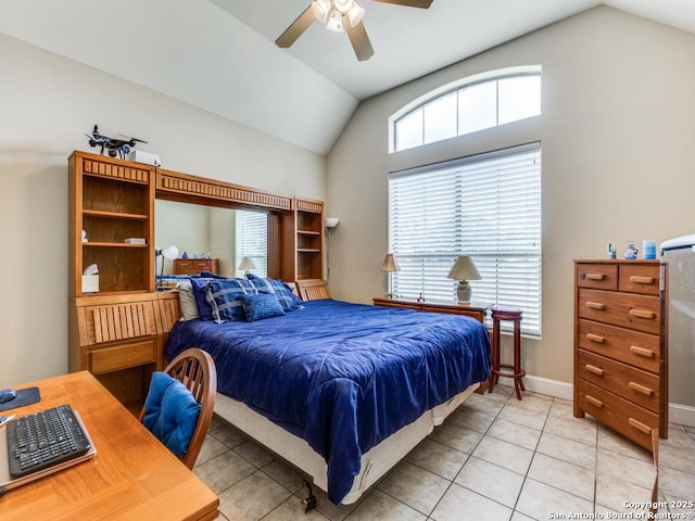 bedroom featuring baseboards, ceiling fan, light tile patterned flooring, and vaulted ceiling
