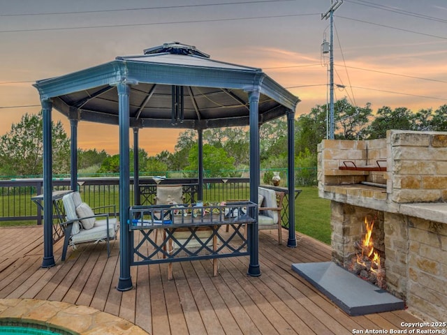 deck at dusk with a gazebo