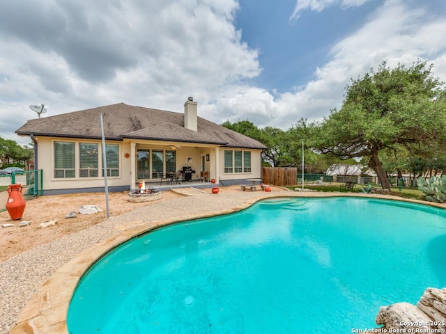 view of pool featuring a patio, a fenced backyard, and a fenced in pool