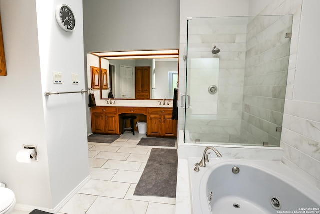 bathroom featuring a tub with jets, tile patterned floors, a shower stall, double vanity, and a sink