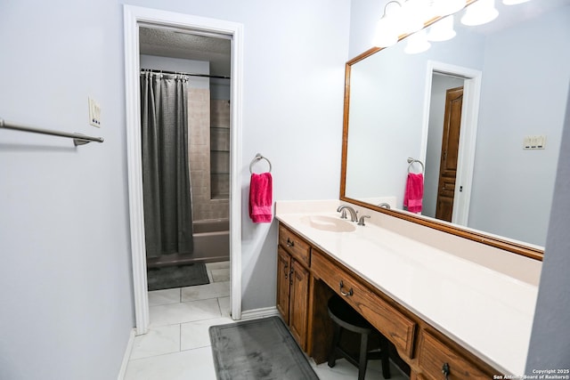bathroom with shower / bathtub combination with curtain, vanity, and baseboards