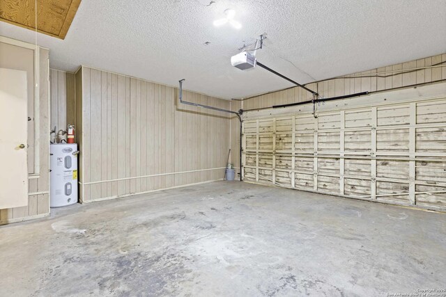 2915 Hunters Strm, San Antonio, TX 78230 - garage featuring water heater and a garage door opener