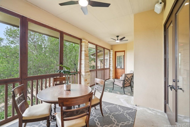 sunroom / solarium with a wealth of natural light and ceiling fan