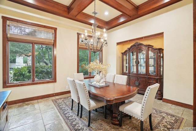 dining space featuring stone tile floors, beamed ceiling, coffered ceiling, baseboards, and an inviting chandelier