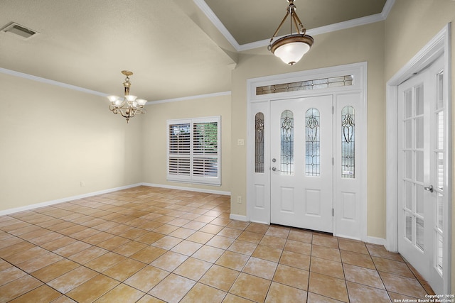 foyer with crown molding, a notable chandelier, light tile patterned flooring, and visible vents