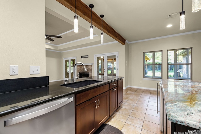 kitchen featuring stainless steel dishwasher, plenty of natural light, french doors, and a sink
