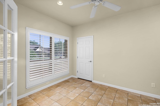 spare room with baseboards, recessed lighting, a ceiling fan, and light tile patterned flooring