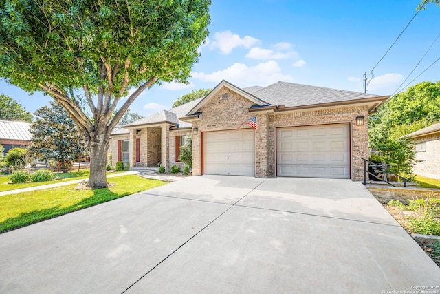 ranch-style house with a front lawn, a garage, a shingled roof, driveway, and brick siding
