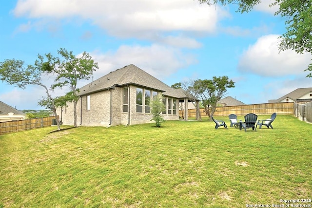 exterior space featuring a yard and a fenced backyard