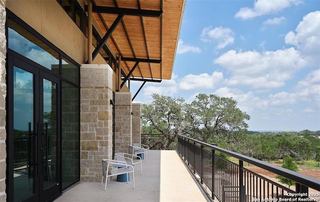 balcony featuring french doors