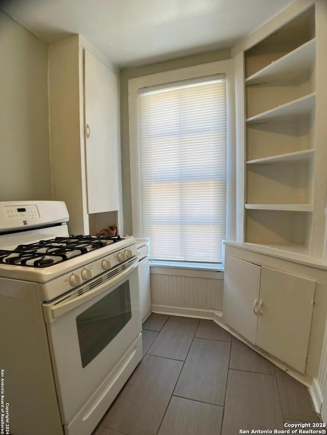 kitchen with gas range gas stove and light countertops