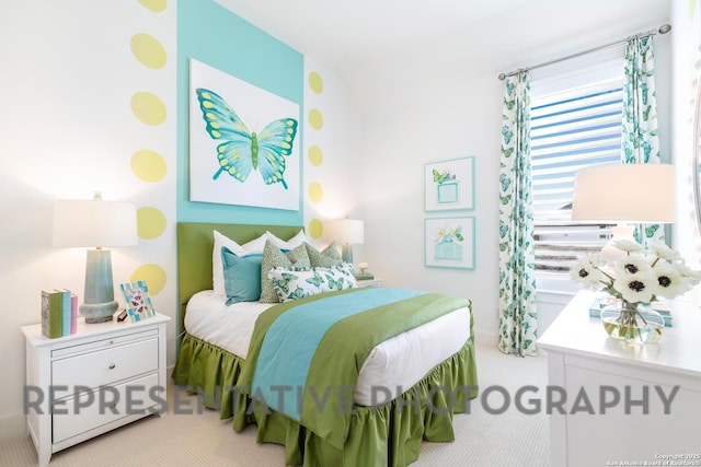 carpeted bedroom with lofted ceiling