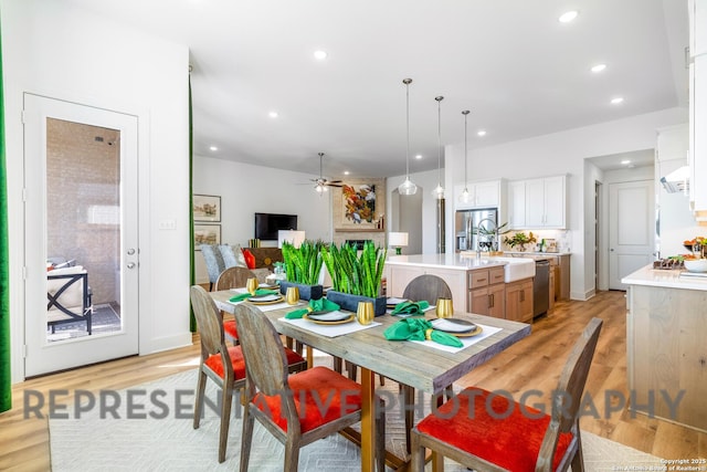 dining room with ceiling fan, recessed lighting, and light wood-style floors