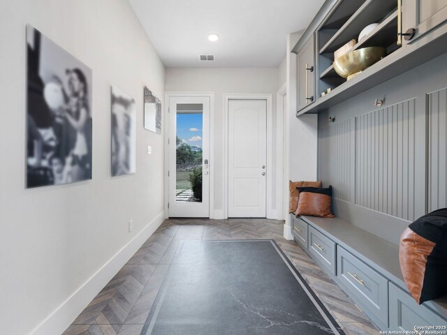 mudroom featuring visible vents and baseboards