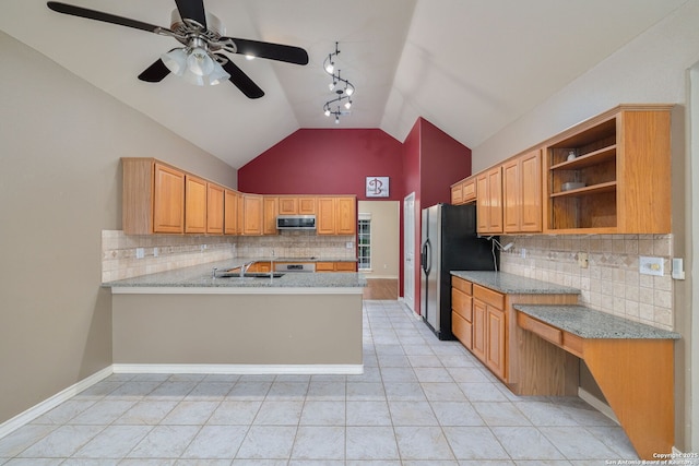 kitchen featuring track lighting, light tile patterned floors, stainless steel appliances, backsplash, and ceiling fan