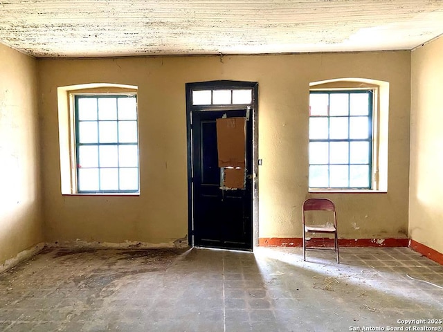 entryway with arched walkways