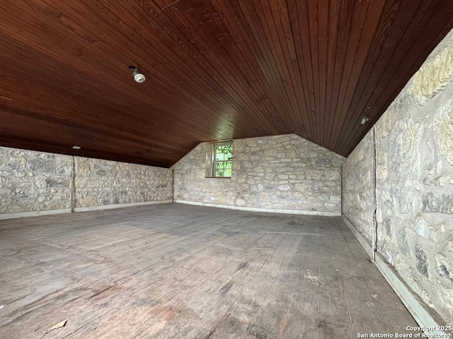 additional living space with lofted ceiling, hardwood / wood-style floors, and wooden ceiling