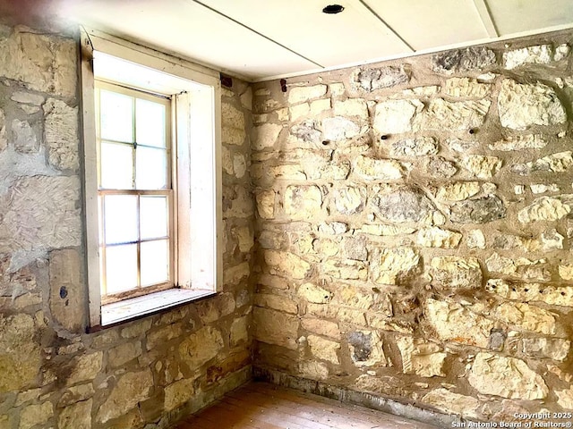 unfurnished room with hardwood / wood-style floors