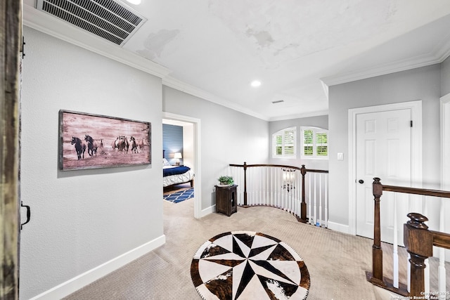 hall featuring an upstairs landing, light colored carpet, visible vents, baseboards, and ornamental molding