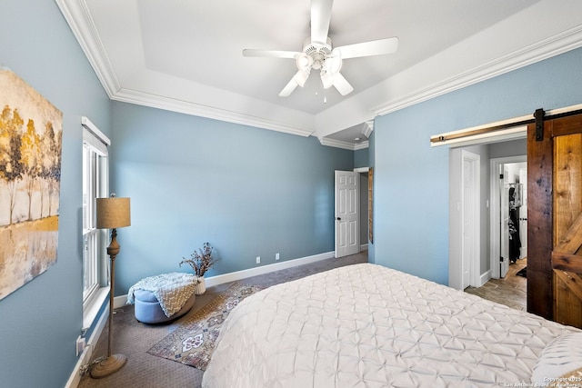 carpeted bedroom with baseboards, a barn door, ornamental molding, and a ceiling fan