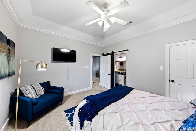 carpeted bedroom with crown molding, baseboards, a barn door, and a tray ceiling