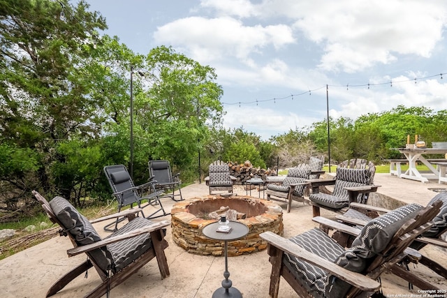 view of patio featuring a fire pit