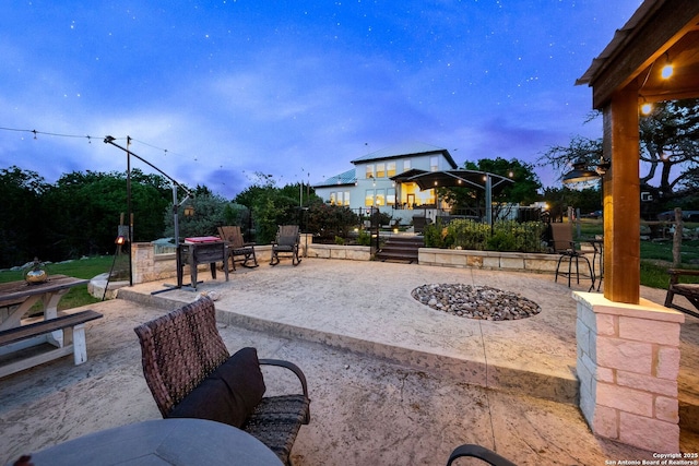 view of patio with an outdoor fire pit and a gazebo