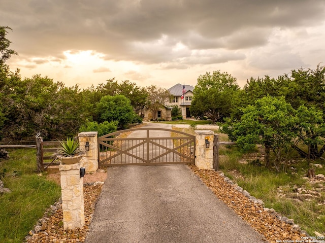 view of gate at dusk