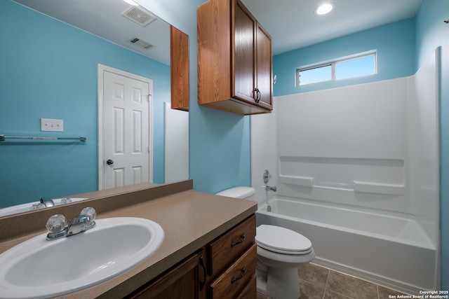 bathroom featuring visible vents, toilet, tile patterned flooring, and vanity