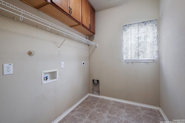 laundry area with hookup for a washing machine, cabinet space, hookup for an electric dryer, baseboards, and light tile patterned flooring