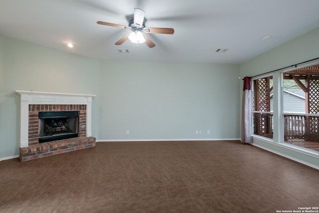 unfurnished living room featuring ceiling fan, visible vents, baseboards, a fireplace, and tile patterned flooring