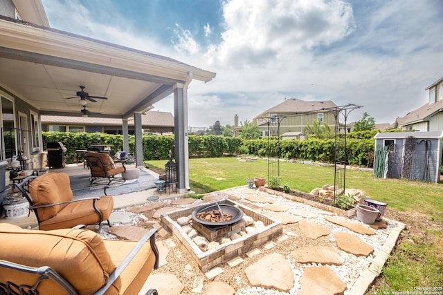 8701 Stackstone, Schertz, TX 78154 - view of patio / terrace featuring ceiling fan and a fire pit