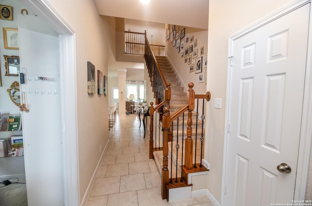 8701 Stackstone, Schertz, TX 78154 - hall with baseboards, stairs, and light tile patterned flooring