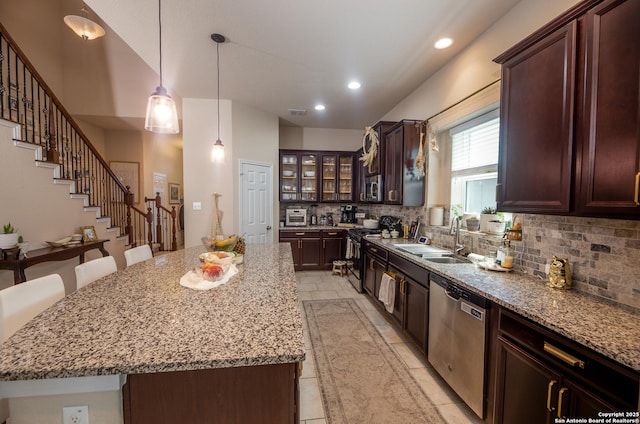 8701 Stackstone, Schertz, TX 78154 - kitchen featuring tasteful backsplash, a sink, stainless steel appliances, a center island, and recessed lighting