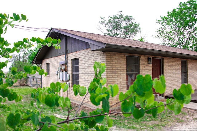 17 Fm 473, Comfort, TX 78013 - view of side of home with fence, a shingled roof, and brick siding