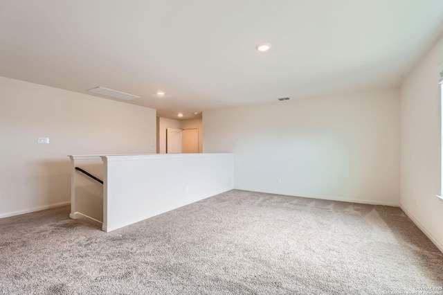 unfurnished room with visible vents, recessed lighting, and carpet floors