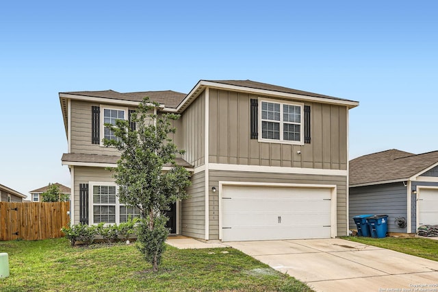 traditional-style home featuring concrete driveway, board and batten siding, fence, a front lawn, and a garage