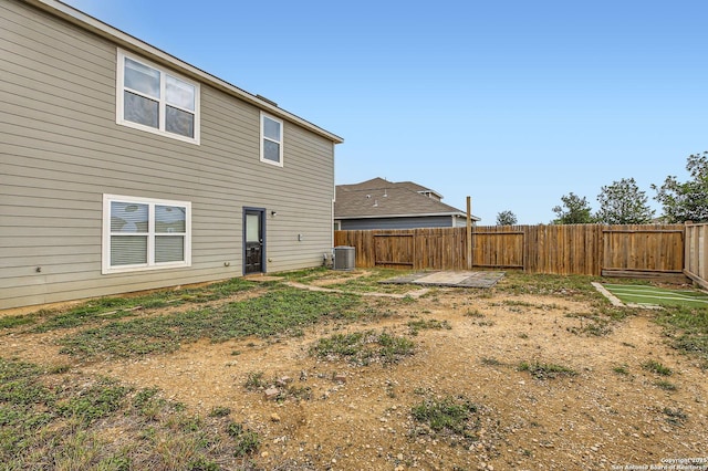 view of yard featuring a fenced backyard and cooling unit