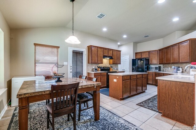 8355 Lazy Pebble, San Antonio, TX 78254 - kitchen with stainless steel microwave, a sink, electric range oven, black refrigerator with ice dispenser, and visible vents