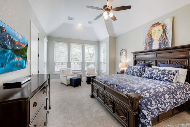 bedroom featuring a ceiling fan, visible vents, vaulted ceiling, and light carpet