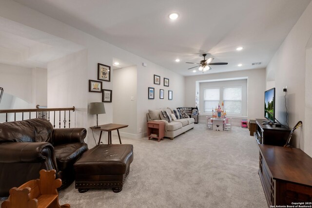 living area featuring carpet flooring, recessed lighting, a ceiling fan, and visible vents