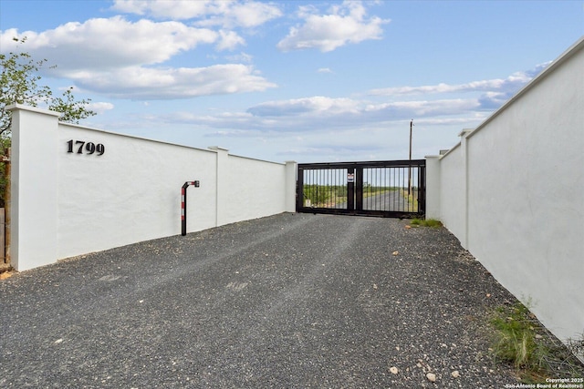 exterior space featuring a gate