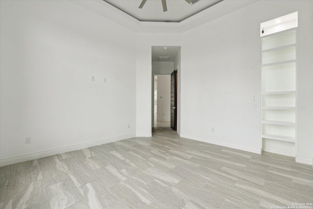 unfurnished bedroom featuring baseboards and a ceiling fan