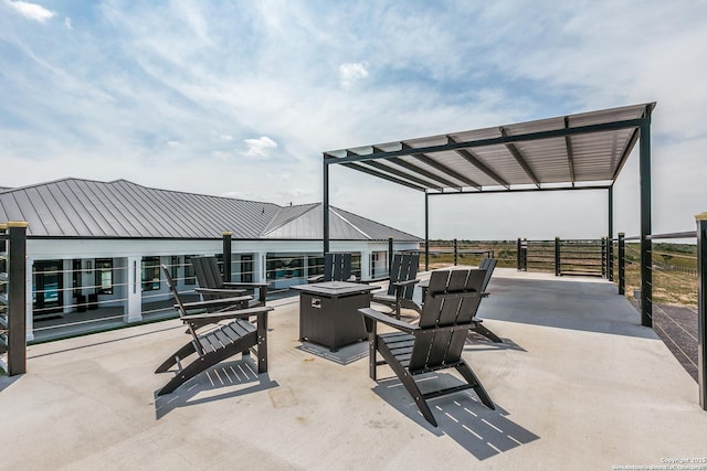 view of patio with an outdoor fire pit
