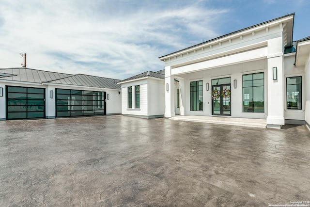exterior space featuring metal roof and a standing seam roof