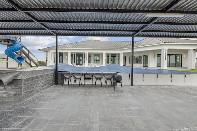 view of patio / terrace featuring outdoor dry bar