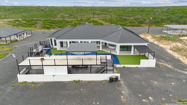 exterior space featuring a wooded view