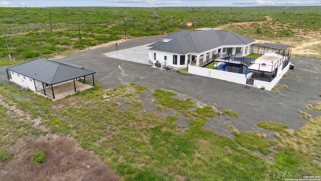 birds eye view of property with a wooded view