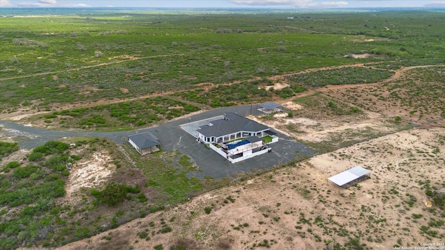 birds eye view of property featuring a rural view